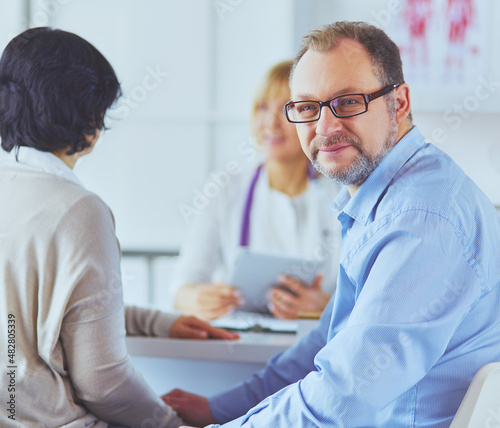 American doctor talking to woman in surgery