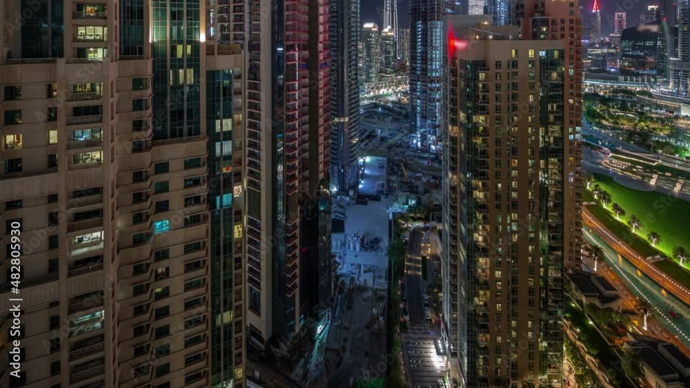 Aerial cityscape night timelapse with illuminated architecture of Dubai downtown. Aerial cityscape night timelapse with illuminated architecture of Dubai downtown.