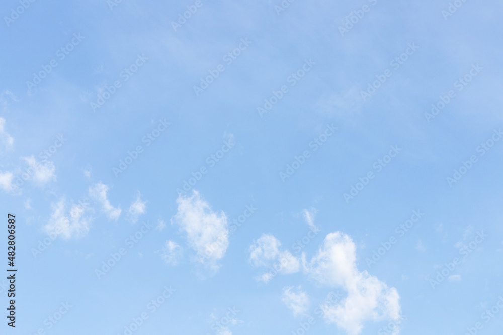 Small light white clouds on a blue clear sky Small light white clouds on a blue clear sky