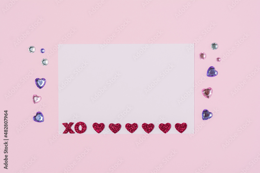 Paper note with valentine pink and purple hearts on pink background. Romantic love letter for Valentines day Paper note with valentine pink and purple hearts on pink background. Romantic love letter for Valentines day