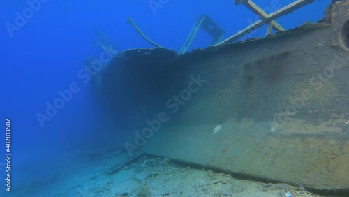 4K.Real old sunken ship wreck underwater at sea.Submerged boat in ocean water.Wrack desolation shipwreck wreckage flotsam derelict vessel cargo boat freighter merchantman merchantship transport ship