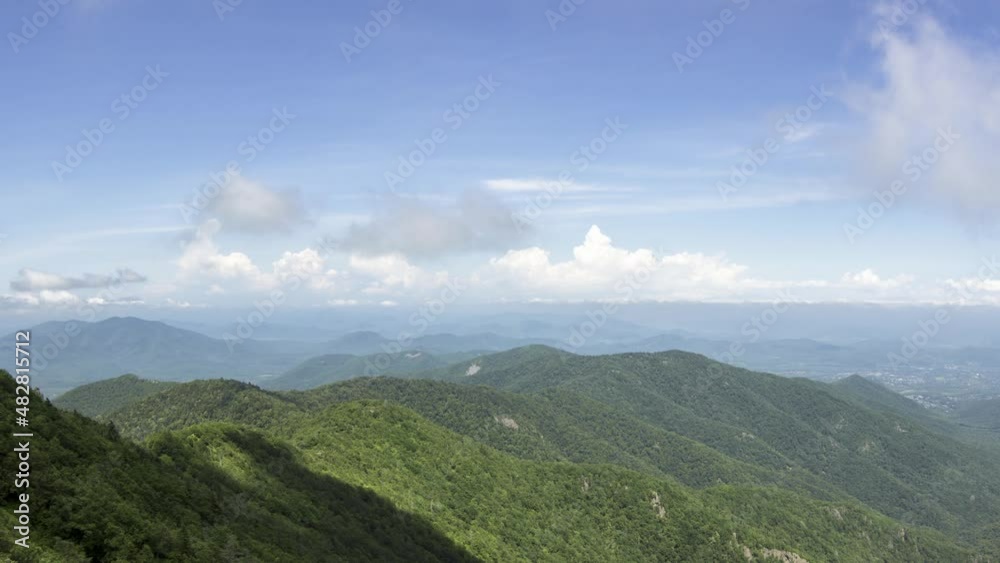 A cloud swirls a green ridge. Timelapse. Summer. A cloud swirls a green ridge. Timelapse. Summer.