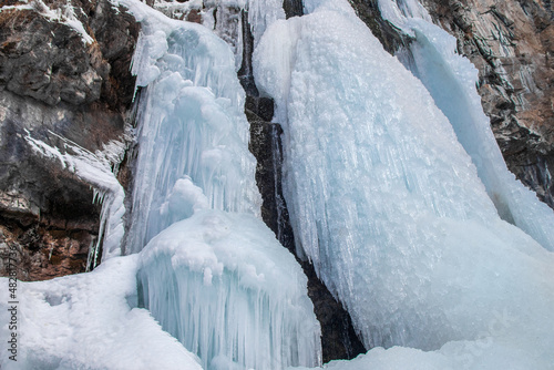 Frozen Butakov Waterfall in gorge in the suburb of the city of Almaty in Kazakhstan. © Roman