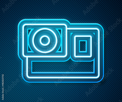 Glowing neon line Action extreme camera icon isolated on blue background. Video camera equipment for filming extreme sports. Vector