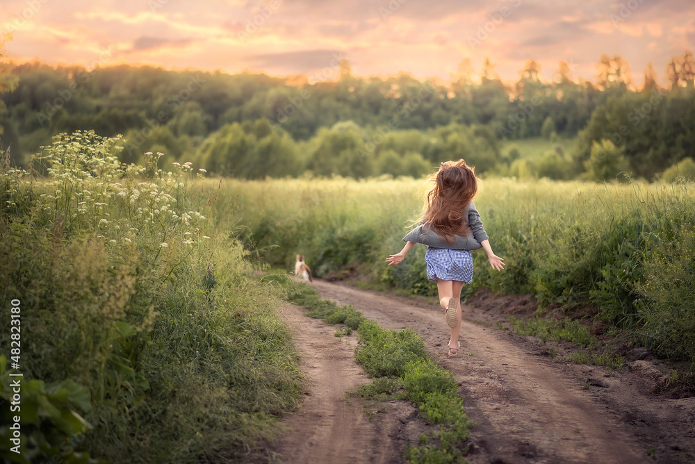 Photo of a running girl on a country road.