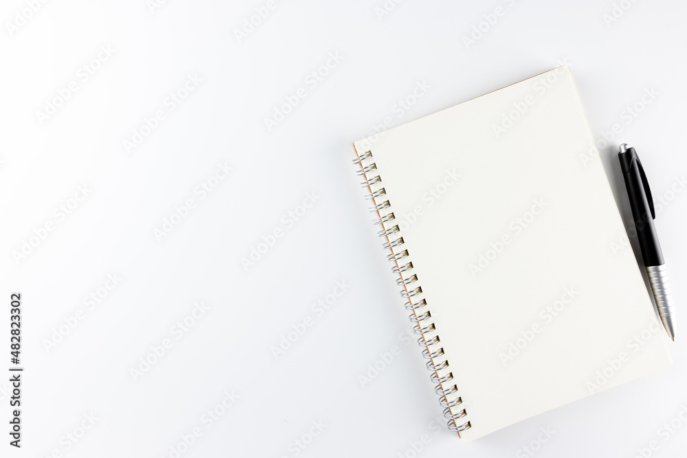 Notebook and pen isolated on white background. empty blank space for copy space. business and educational concept. Notebook and pen isolated on white background. empty blank space for copy space. business and educational concept.