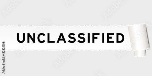  Ripped gray paper background that have word unclassified under torn part