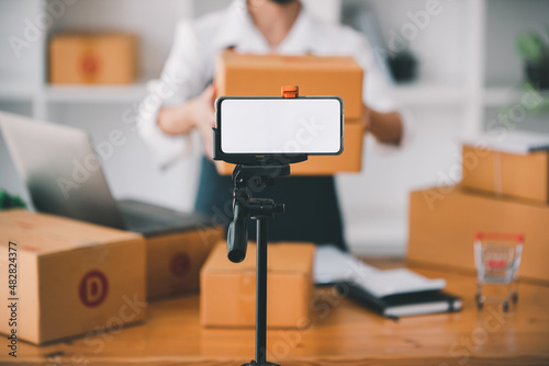 Small start-up business owners live online sales at work, salespeople, check production orders. Pack products, send to customers, sell ecommerce delivery ideas.