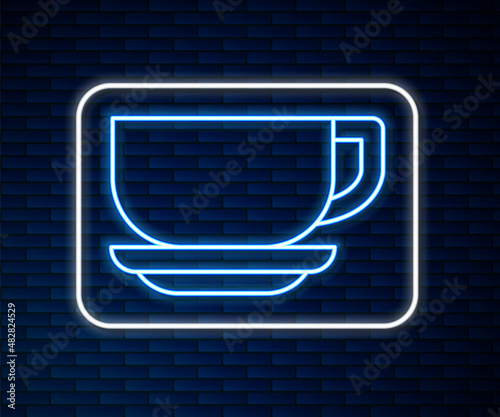 Glowing neon line Coffee cup icon isolated on brick wall background. Tea cup. Hot drink coffee. Vector