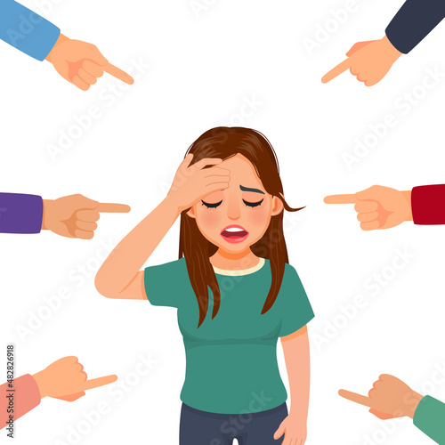 Depressed young woman feeling sad, guilty and ashamed get bullied with finger surrounding pointing at her blaming and accusing her in public