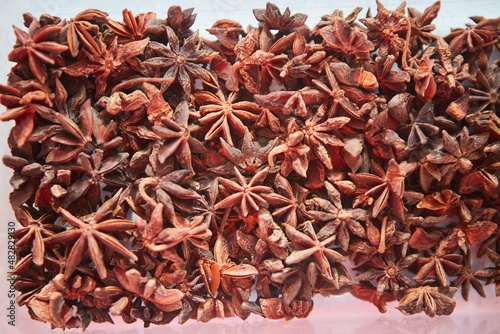 Herb spice star anise. A large amount of seasoning for the kitchen and cooking.