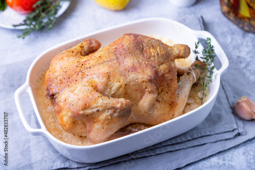 Whole baked chicken in sea salt. Home cuisine, traditional dish. Close-up.