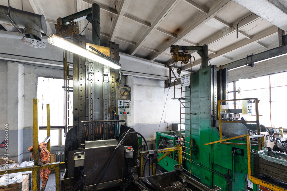 Modern automobile manufacturing workshop. Factory with steel constructions. Plant of car production. Industrial scenery background Modern automobile manufacturing workshop. Factory with steel constructions. Plant of car production. Industrial scenery background