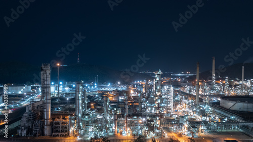 Chemical industry storage tank and oil refinery in Industrial Plant at night over lighting, Fuel and power generation, petrochemical factory industry zone