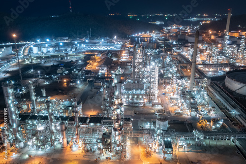 Chemical industry storage tank and oil refinery in Industrial Plant at night over lighting, Fuel and power generation, petrochemical factory industry zone