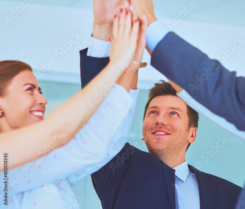 Business team joining hands together