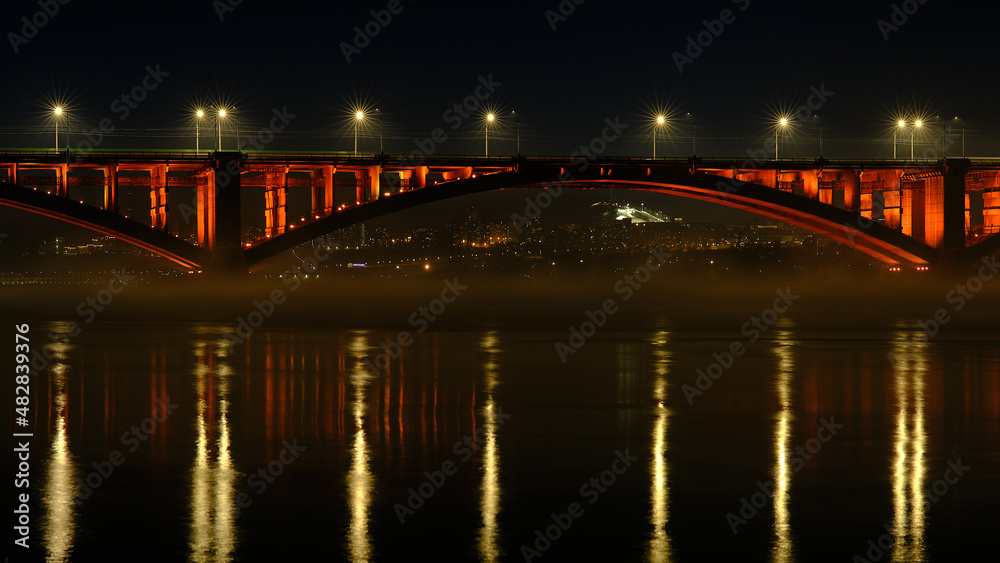 Night city lights, river, bridge