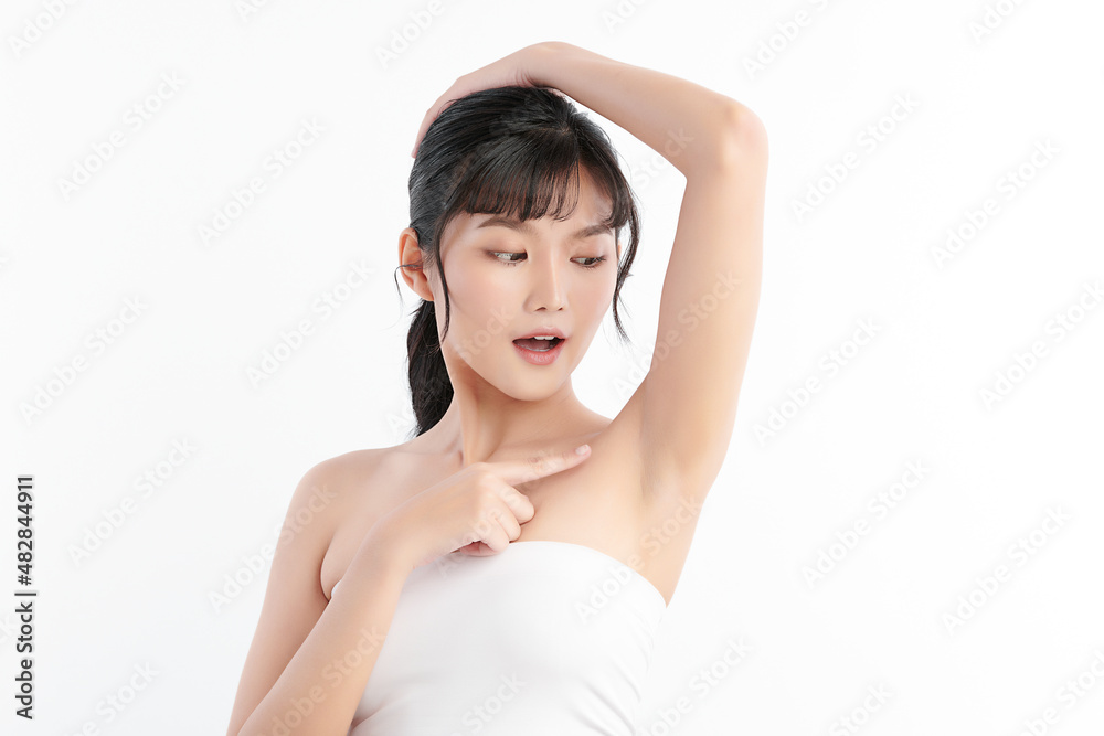 Beautiful Young Asian woman lifting hands up to show off clean and hygienic armpits or underarms on white background, Smooth armpit cleanliness and protection concept Beautiful Young Asian woman lifting hands up to show off clean and hygienic armpits or underarms on white background, Smooth armpit cleanliness and protection concept