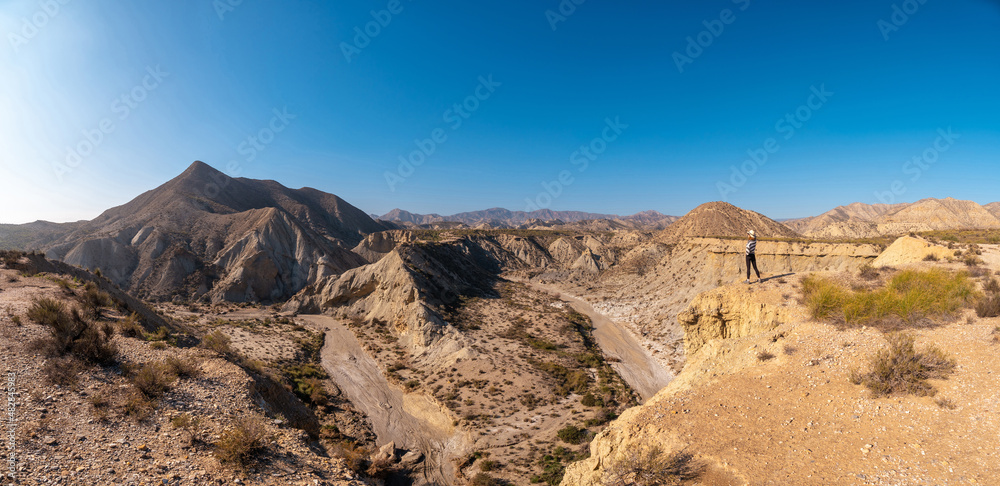 Panoramic in the curve of the path of the desert canyon of Tabernas, province of Almería, Andalusia. On a trek in the Rambla del Infierno Panoramic in the curve of the path of the desert canyon of Tabernas, province of Almería, Andalusia. On a trek in the Rambla del Infierno