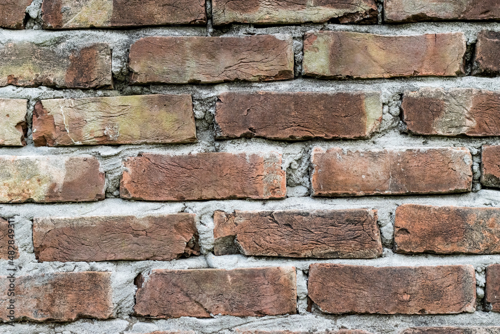 Close up view of newly constructed red brick wall surface for background Close up view of newly constructed red brick wall surface for background