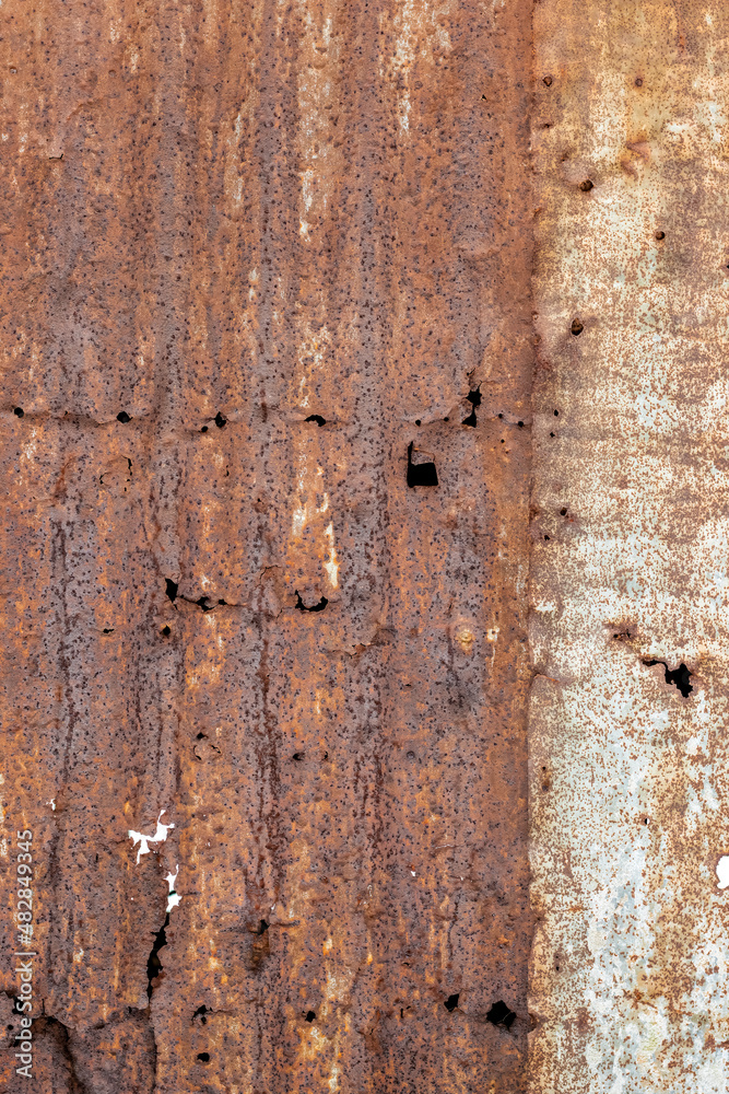 Broken old wavy iron sheet with heavy rust for texture background Broken old wavy iron sheet with heavy rust for texture background