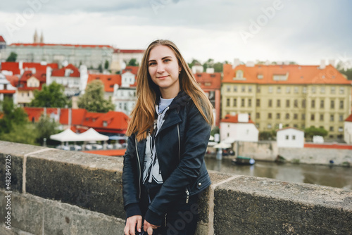 Woman on view point with amazing view. Cute female tourist in Prague, Czech republic.