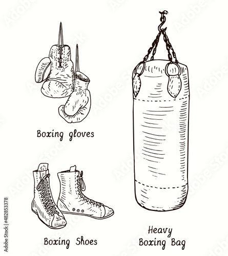 Boxing shoes, gloves and heavy boxing bag. Ink black and white doodle drawing in woodcut style.