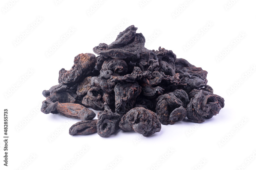 pile of sun dried garcinia fruits, black shriveled flavoring herb native to south asia, also known as brindle berry, goraka or malabar tamarind, isolated on white background pile of sun dried garcinia fruits, black shriveled flavoring herb native to south asia, also known as brindle berry, goraka or malabar tamarind, isolated on white background