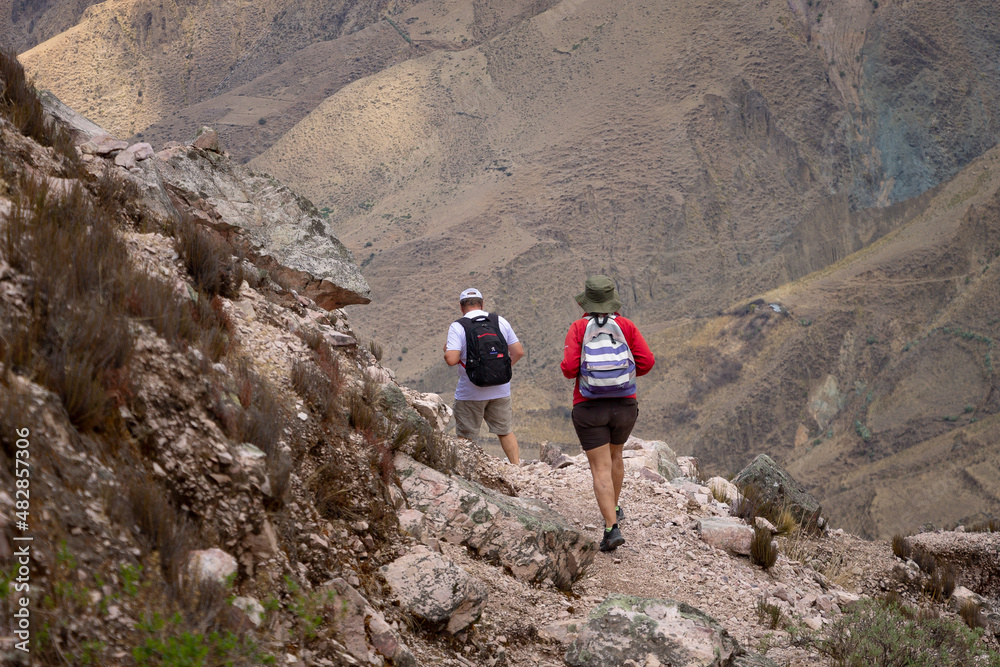 Obraz premium Elderly couple trekking through mountains in northern Argentina.