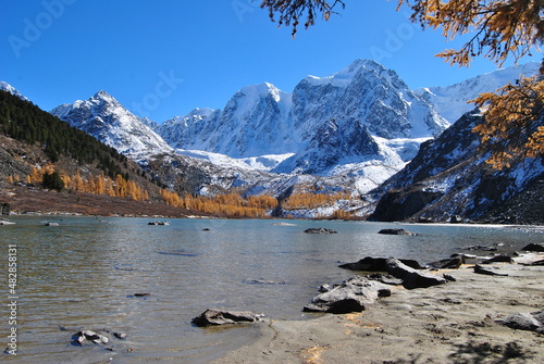 Mountain lake in autumn. Karakol lakes in Altai. The Altai Republic is the North-Chuisky Ridge. Autumn in Altai.