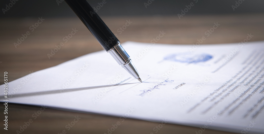 Pen signing in contract. Business Pen signing in contract. Business