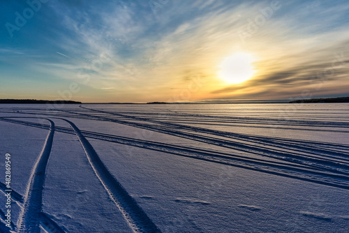 frozen lake sunset in the snow