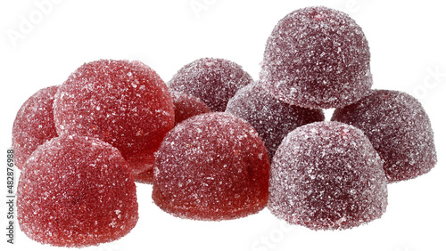 Handful of red and orange candy close up