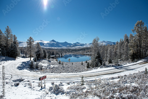 Lake in the mountains in winter. Lake Kidel. Altai.