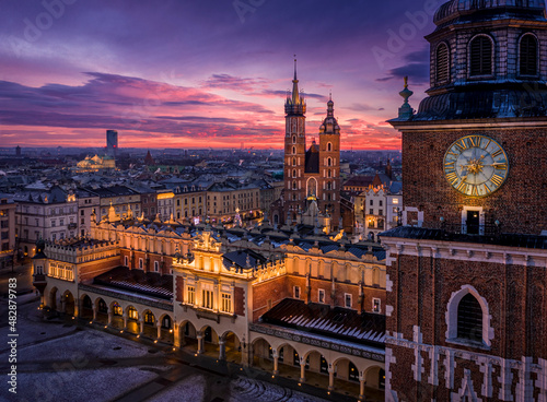 Panorama of Main Square (Saint Mary's Basilica, Sukiennice - Town Hall, Town Hall Tower) in Krakow during magic dawn in winter, Poland photo