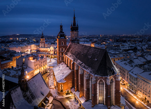 Panorama of Old Town  Main Square  Saint Mary s Basilica  Sukiennice - Town Hall  Town Hall Tower  in Krakow during magic dawn in winter  Poland