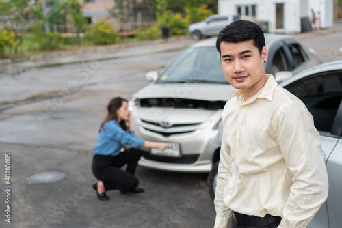 Happy businessman drivers do not worry after a car accident because have car accident insurance. And sad men drivers do not have car accident insurance. © Prot