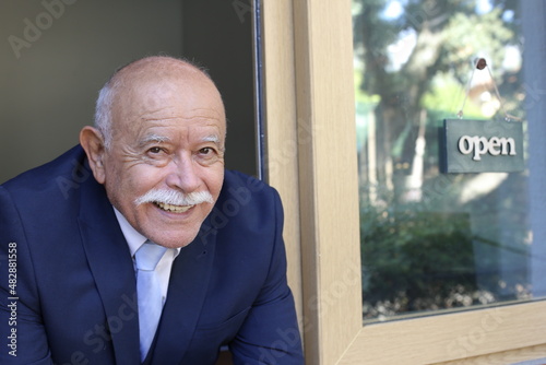 Senior bald businessman with a mustache photo