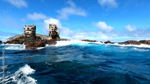 blue ocean blue sky and unrealistically beautiful and formidable rocks of the uninhabited Galapagos Islands 