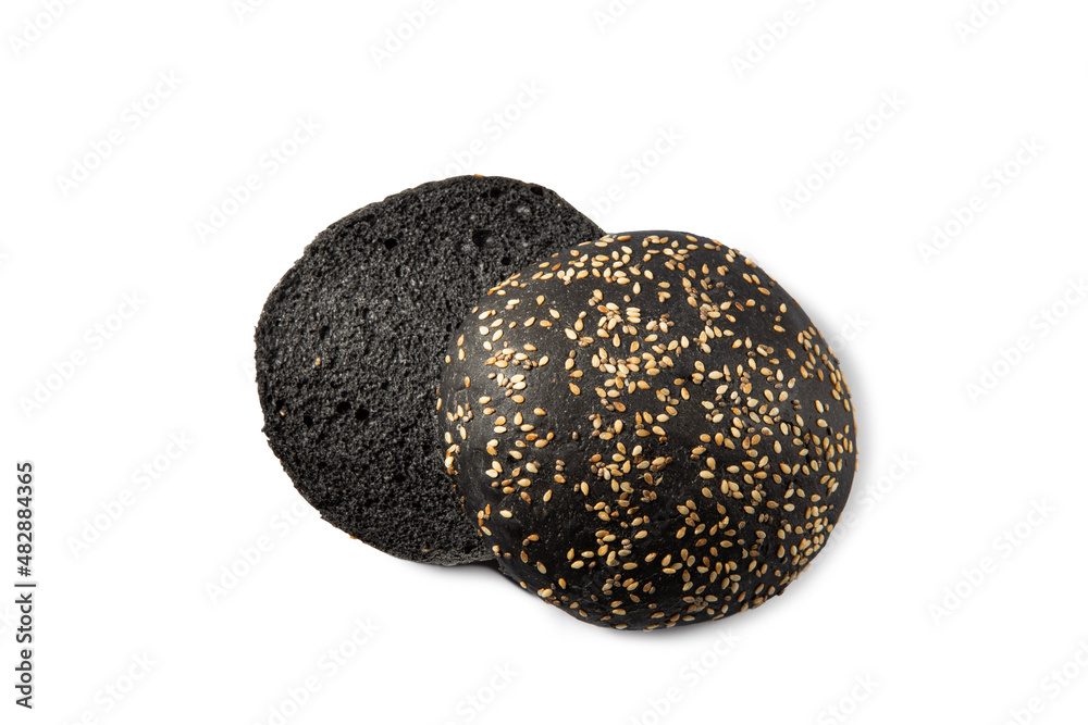 Sliced black bun for burger on white isolated background. Sliced black bun for burger on white isolated background.