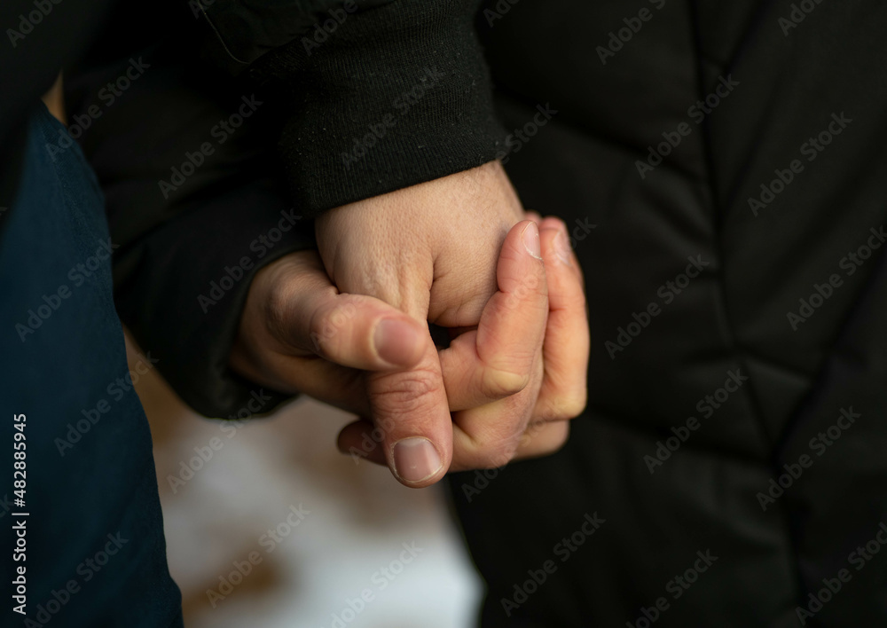 Love couple holding their hands 