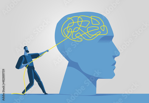 Uomo tira un filo che si è intrecciato nel cervello umano