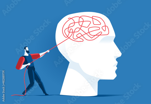 Uomo tira un filo che si è intrecciato nel cervello umano