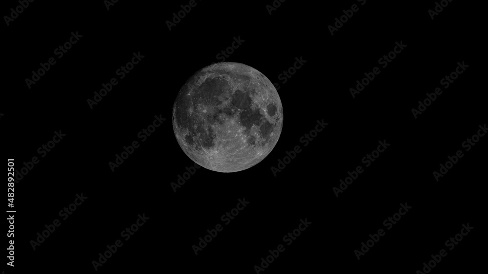 Obraz premium Full Earth's Moon glow on black background. Image in high resolution. Bright lunar satellite