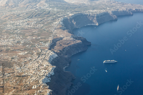 Fototapeta Naklejka Na Ścianę i Meble -  Santorini island holidays in Greece travel traveling Fira Thera town Mediterranean Sea aerial photo view Santorin