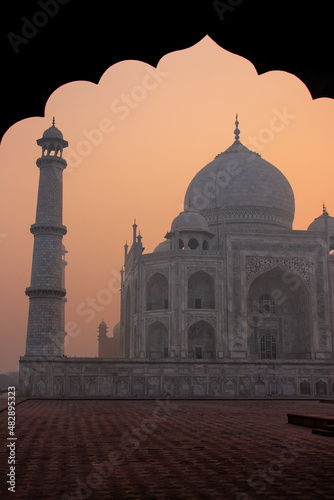 Taj Mahal at sunrise framed with the arch of the mosque, Agra, Uttar Pradesh, India