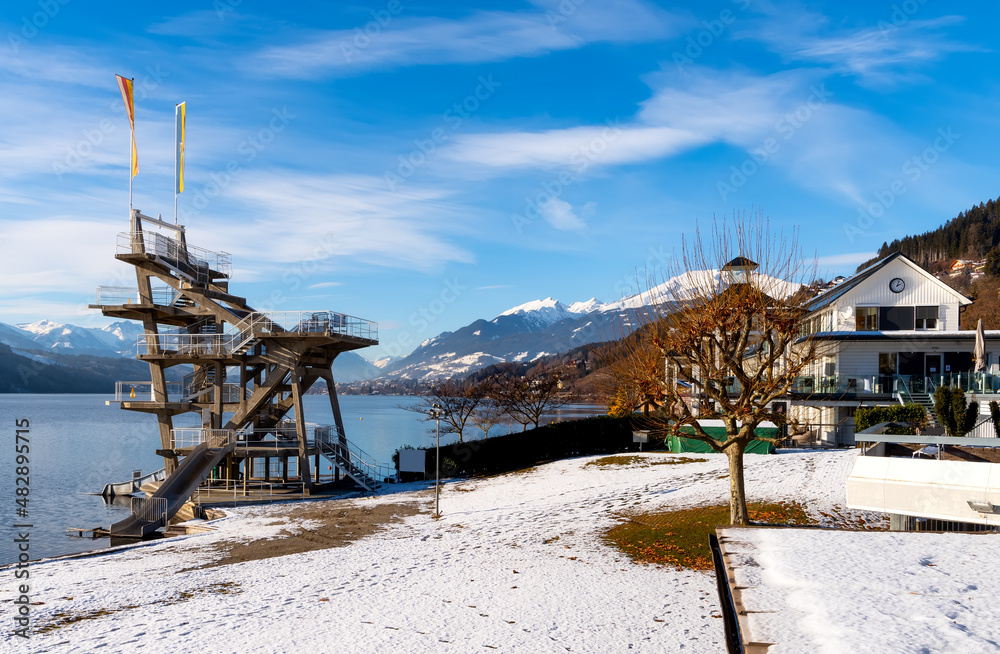 Lake promenade with jump tower at Millstadt lake (Millstätter See), Austria Lake promenade with jump tower at Millstadt lake (Millstätter See), Austria