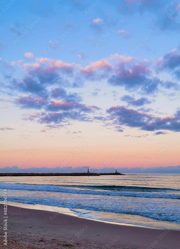 Obraz premium Beach scene: Seascape at sunset.