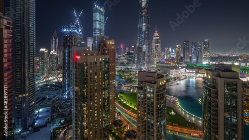 Dubai Downtown cityscape with tallest skyscrapers aerial night timelapse.