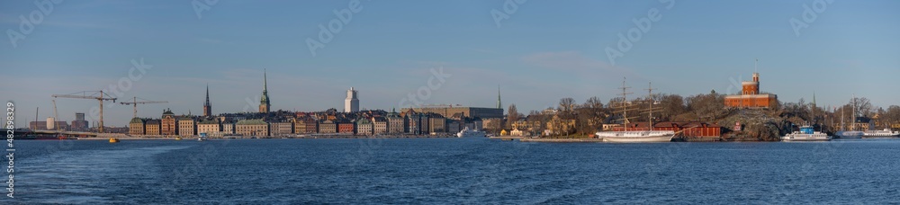 Panorama view over the island Kastellholmen with a castell and the skyline of the old town Gamla Stan a sunny winter day in Stockholm